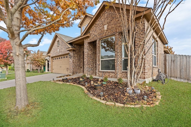 view of front facade with a garage and a front lawn