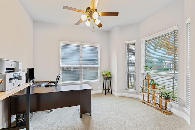 home office with ceiling fan and light colored carpet