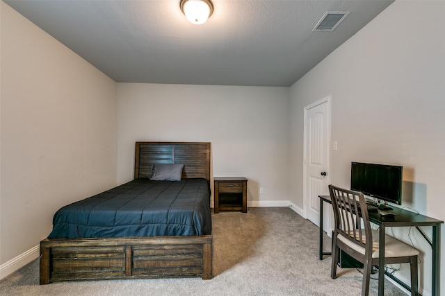 bedroom featuring carpet floors, visible vents, and baseboards