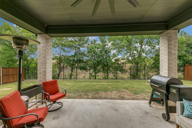 view of patio / terrace featuring a fenced backyard, ceiling fan, and area for grilling