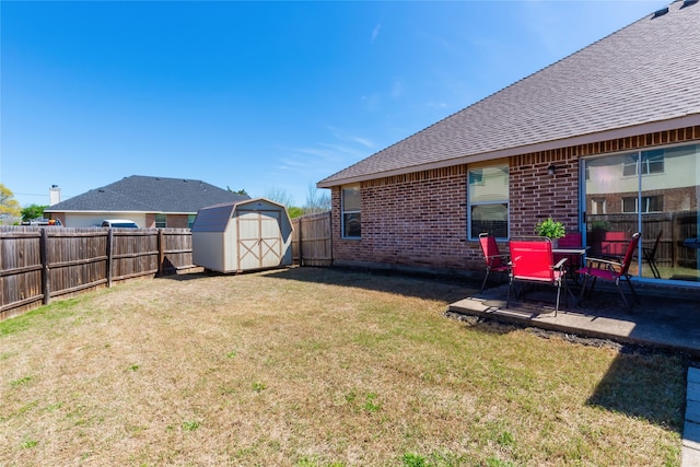 view of yard featuring a patio and a shed