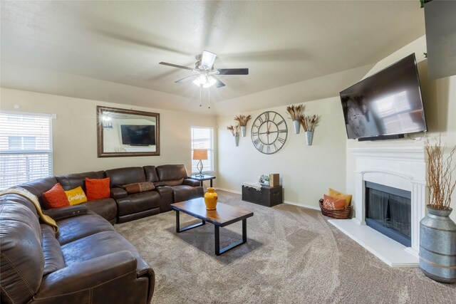 living room featuring plenty of natural light, ceiling fan, and light colored carpet