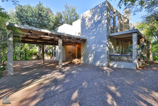 view of front of home with a carport