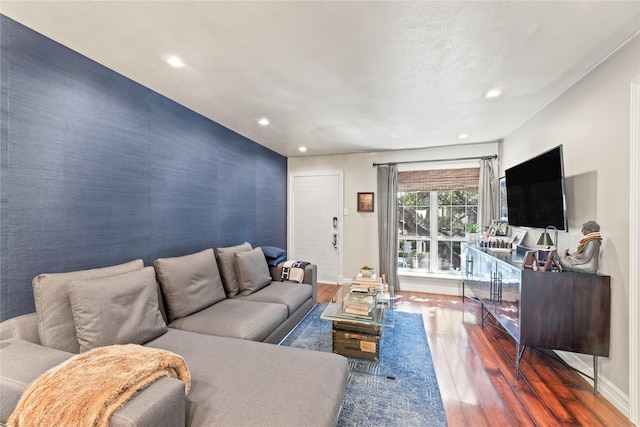 living room with dark hardwood / wood-style flooring