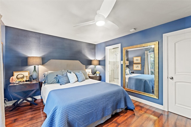 bedroom with dark hardwood / wood-style floors, ceiling fan, and ensuite bathroom