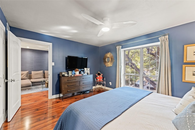 bedroom featuring hardwood / wood-style floors and ceiling fan