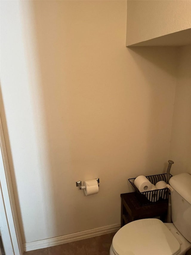 bathroom featuring tile patterned floors and toilet