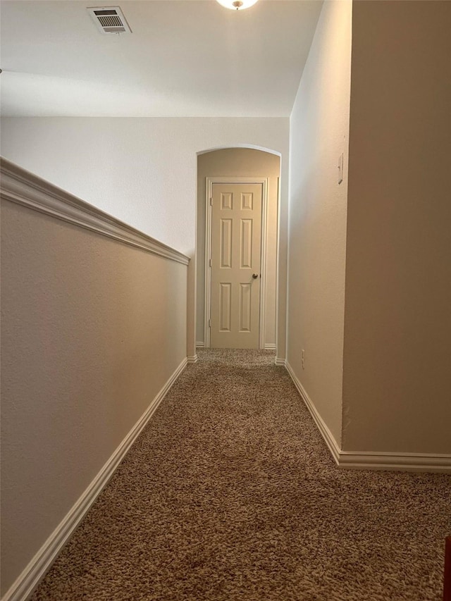 hall with carpet flooring