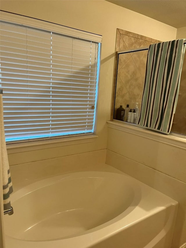 bathroom featuring shower with separate bathtub