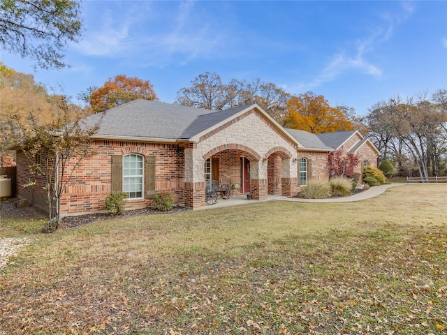 ranch-style home with a front yard