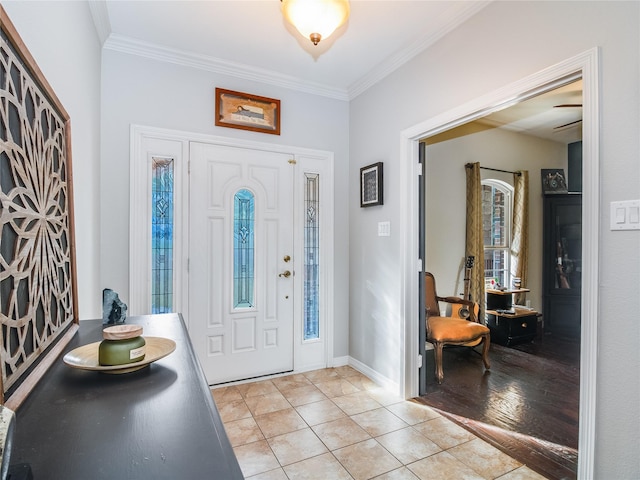 foyer entrance featuring light hardwood / wood-style flooring and ornamental molding