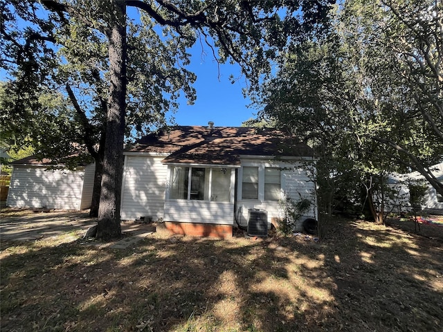 view of home's exterior featuring a yard and central AC