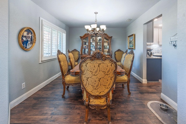 dining area featuring a notable chandelier and dark hardwood / wood-style flooring