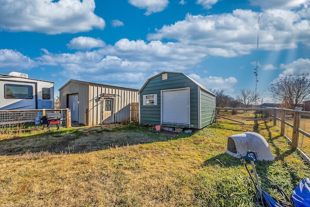 view of outbuilding featuring a yard