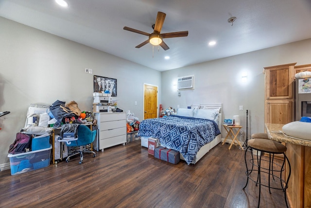 bedroom featuring ceiling fan, dark hardwood / wood-style floors, and a wall mounted AC