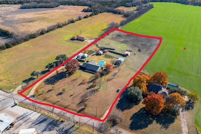 birds eye view of property with a rural view