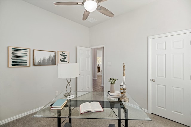 office with carpet flooring and ceiling fan