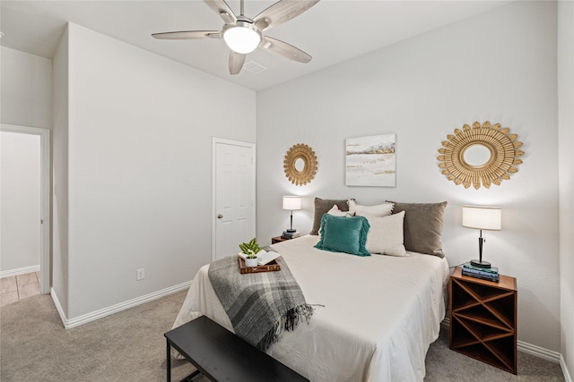 bedroom featuring ceiling fan and light carpet