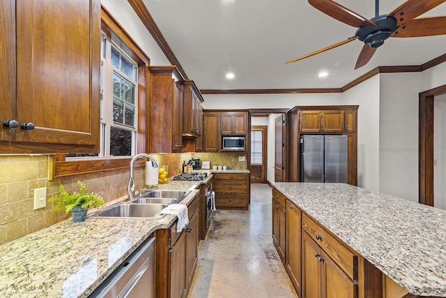 kitchen featuring light stone counters, stainless steel appliances, and backsplash