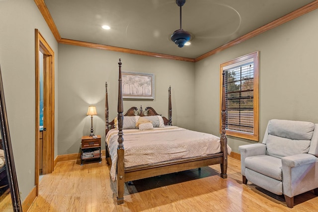 bedroom featuring crown molding, ceiling fan, and light hardwood / wood-style flooring