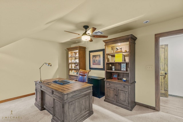 carpeted office featuring ceiling fan