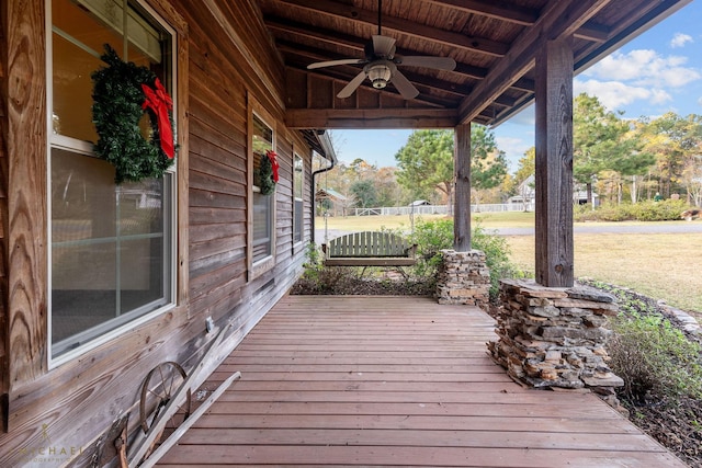 wooden terrace featuring ceiling fan and covered porch