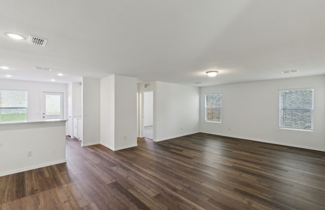 empty room featuring dark hardwood / wood-style flooring