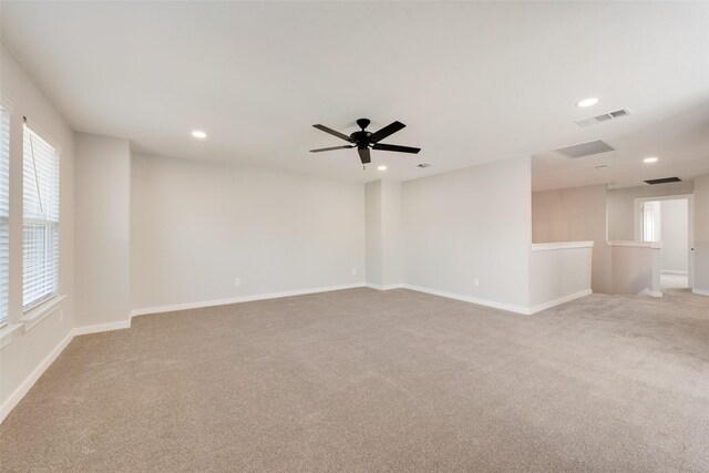 walk in closet featuring light carpet