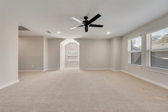 empty room featuring baseboards, visible vents, light colored carpet, ceiling fan, and recessed lighting