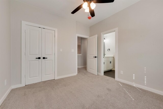 full bathroom featuring combined bath / shower with glass door, vanity, and toilet