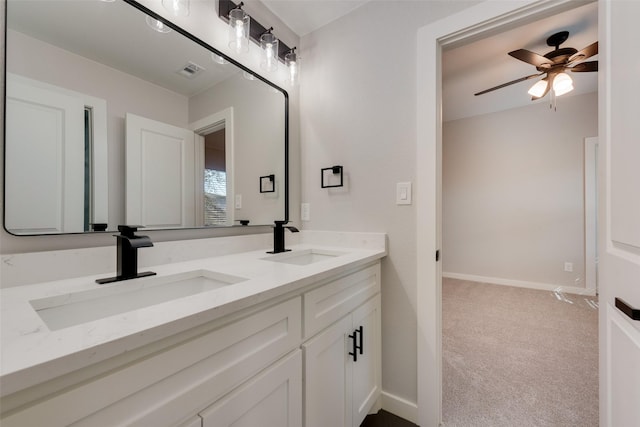 full bath featuring double vanity, ceiling fan, visible vents, and a sink