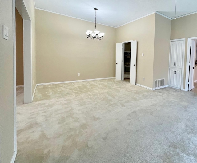 unfurnished room with light colored carpet, an inviting chandelier, and ornamental molding