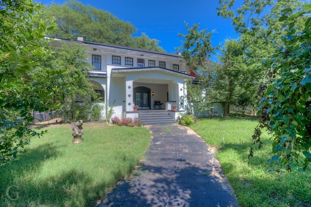 view of front of home featuring a porch and a front yard