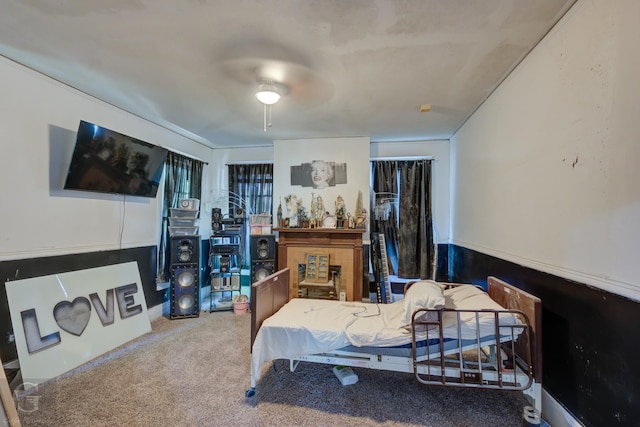 bedroom with ceiling fan and carpet