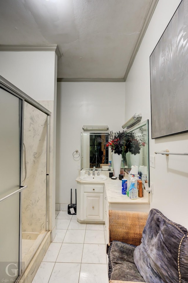 bathroom featuring crown molding, vanity, tile patterned flooring, and a shower with door