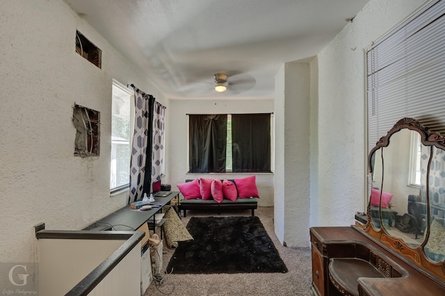 hallway with light colored carpet