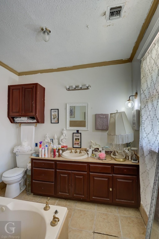 bathroom with vanity, a textured ceiling, and ornamental molding