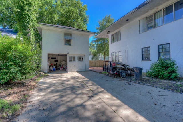 view of side of property featuring a garage