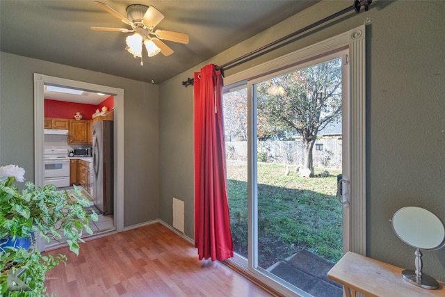 interior space featuring ceiling fan and light wood-type flooring