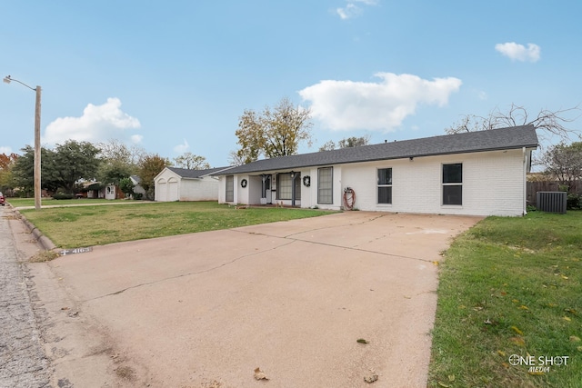 single story home featuring central air condition unit and a front yard