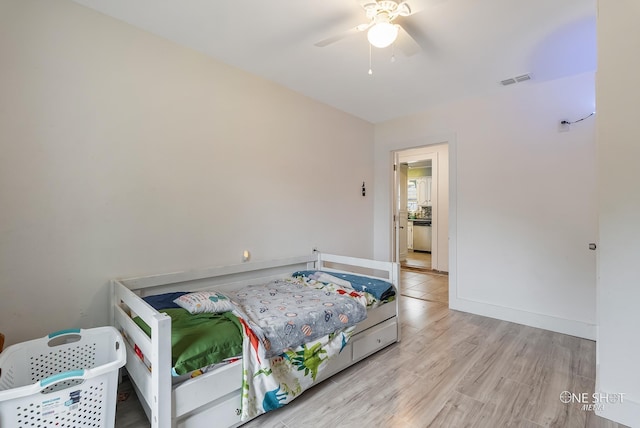 bedroom featuring ceiling fan and light wood-type flooring