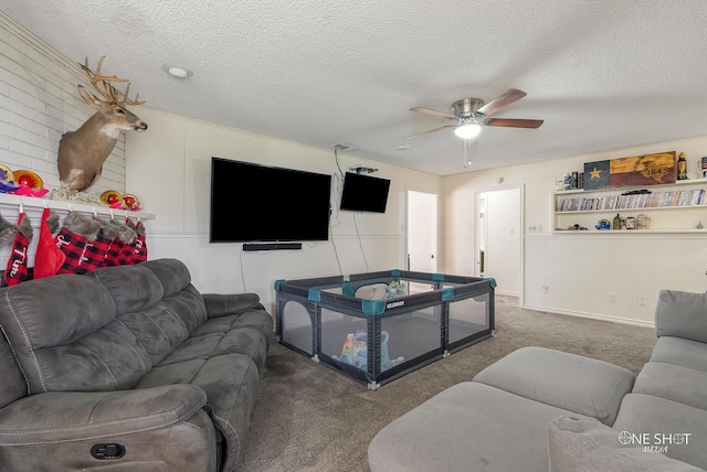 living room with ceiling fan, carpet floors, and a textured ceiling