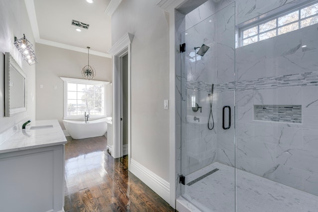 bathroom with wood-type flooring, vanity, shower with separate bathtub, and crown molding