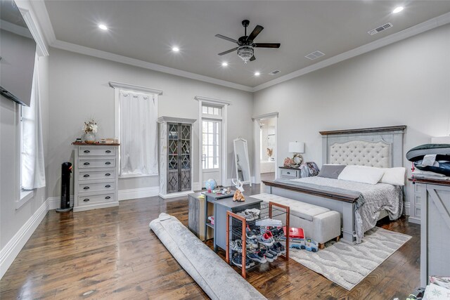 bedroom featuring ceiling fan, dark hardwood / wood-style flooring, and crown molding