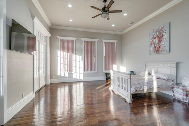 bedroom with dark hardwood / wood-style floors, ceiling fan, and crown molding