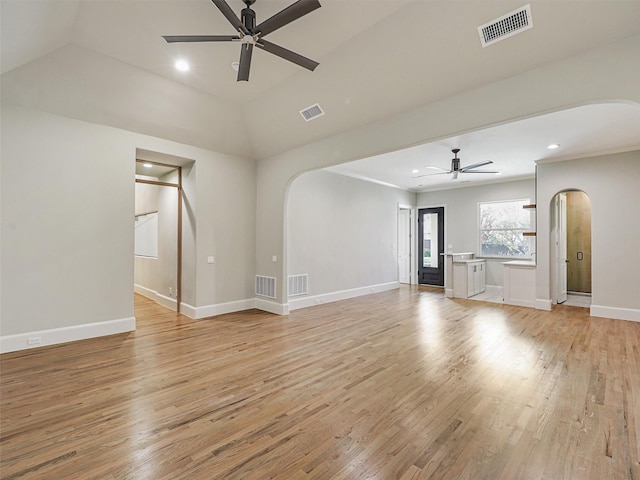 unfurnished living room featuring ceiling fan, light hardwood / wood-style flooring, and vaulted ceiling