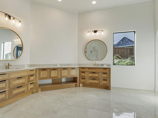 bathroom featuring vanity and ornamental molding