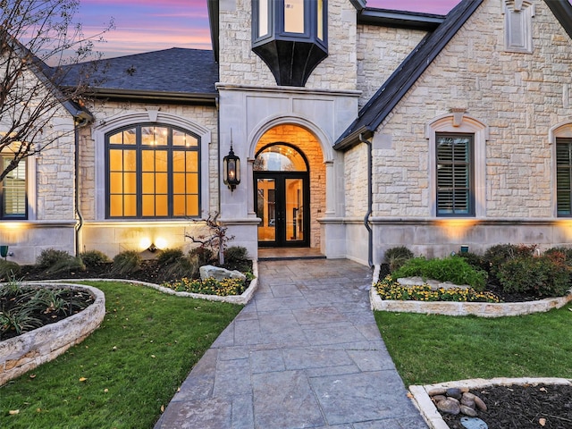 exterior entry at dusk with french doors