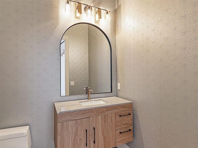 bathroom with vanity and toilet