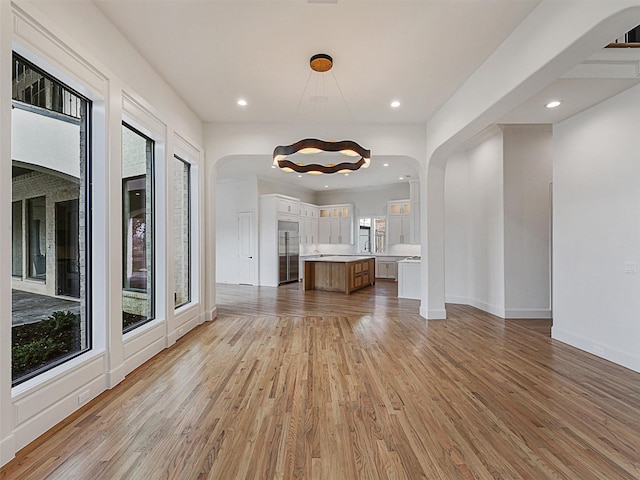 unfurnished living room with light hardwood / wood-style flooring